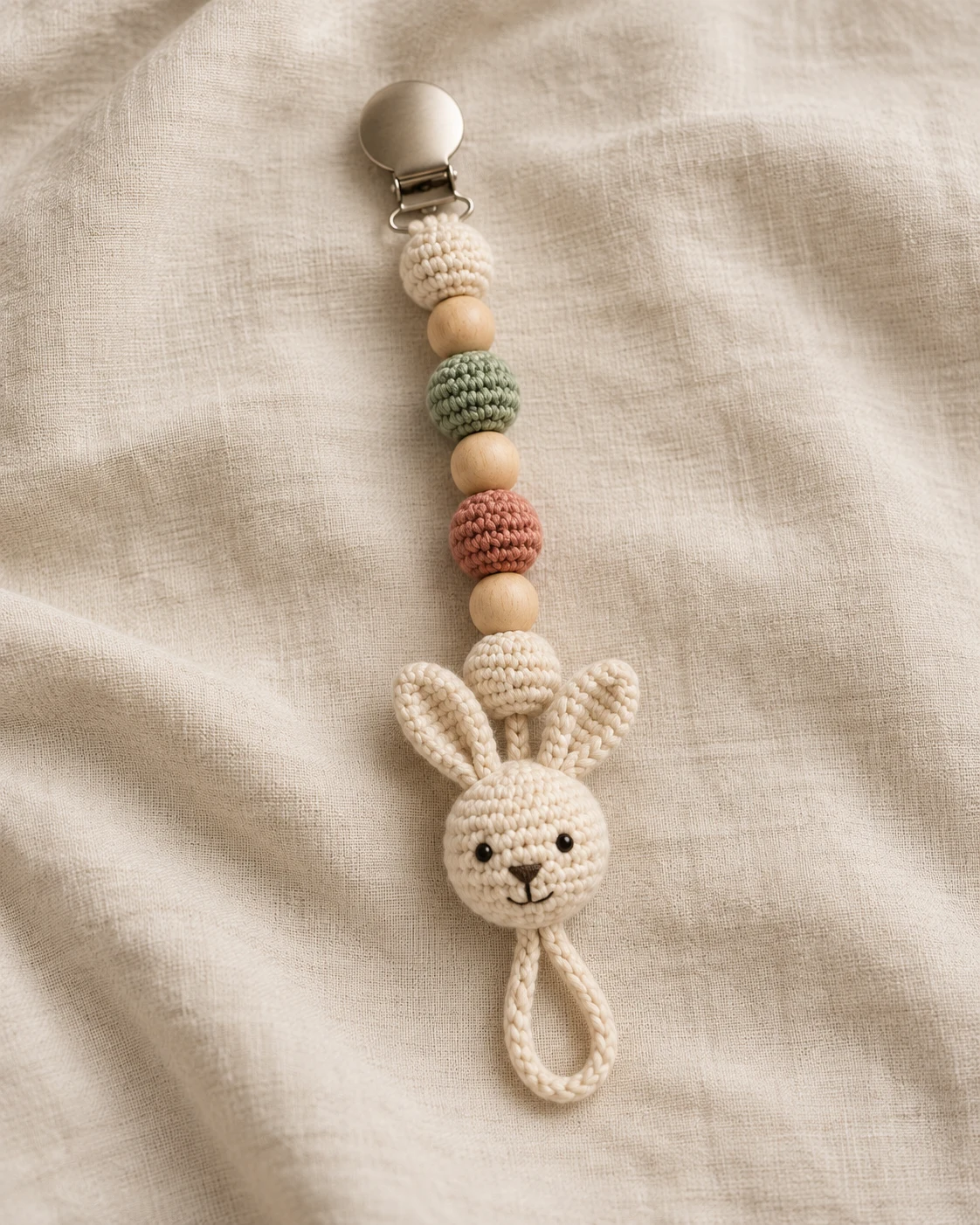 Crochet pacifier holder with an original bunny character detail